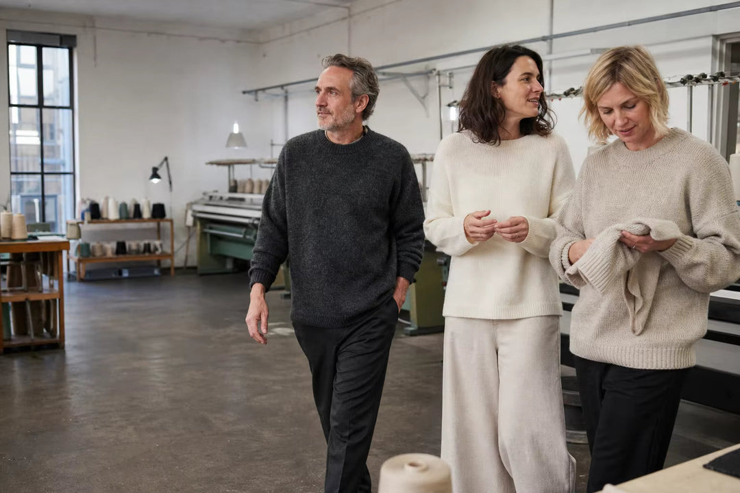 Wynool knitwear atelier with models wearing natural knit sweaters